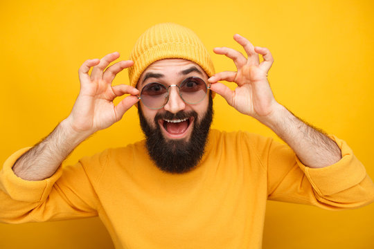 Cheerful Hipster Trying Sunglasses