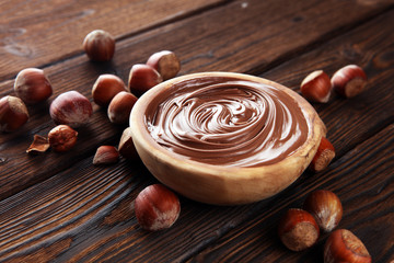 Homemade hazelnut spread in wooden bowl. Hazelnut Nougat cream