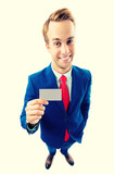 Businessman showing business or plastic card, with copyspace