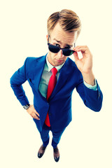 portrait of funny skeptic young businessman in sunglasses - obrazy, fototapety, plakaty