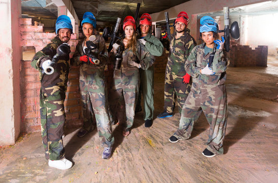 Portrait of teams who are ready for paintball
