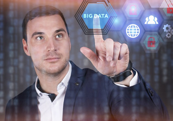 Business, Technology, Internet and network concept. Young businessman working on a virtual screen of the future and sees the inscription: Big data