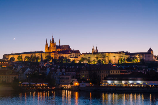 Prague, Bohemia, Czech Republic. Hradcany is the Praha Castle with churches, chapels, halls and towers. Evening view of the tourist attraction.