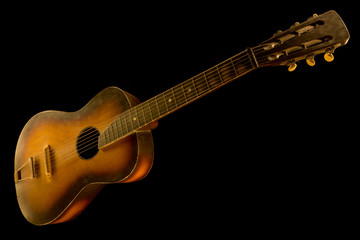 Fototapeta na wymiar old acoustic guitar on black background