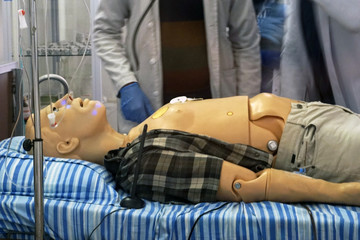 Robotic character with medic aim / Futuristic medical patient. Robot works as patient during medical simulation trainings.