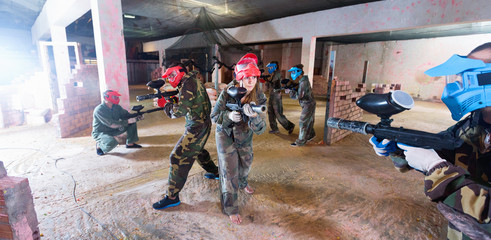 Players are targeting in opponents from cover in battlefield.