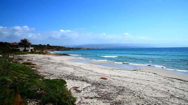 Turquoise water in Le Bombarde beach, Alghero. Sardinia, Italy