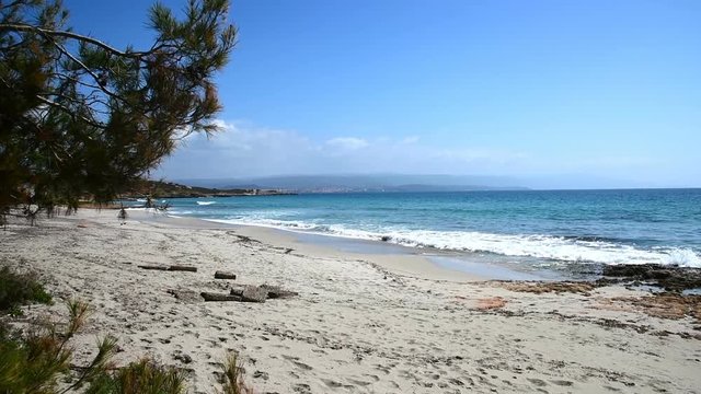 Turquoise water in Le Bombarde beach, Alghero. Sardinia, Italy