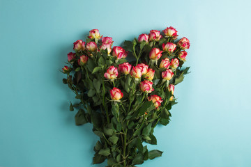 A bouquet of roses in the shape of a heart.