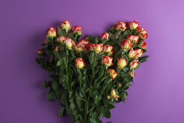 A bouquet of roses in the shape of a heart.