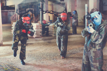 Player aiming in opponents in paintball field
