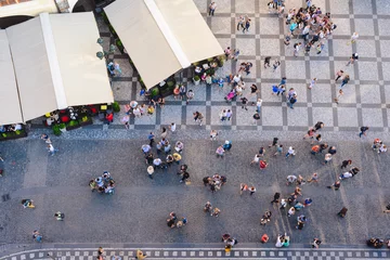 Fotobehang PRAGUE, CZECH REPUBLIC - MAY 2017: Aerial View of people visiting the Old Town Square from on top Old Town Hall tower in Prague, Czech Republic © Stanislav Samoylik
