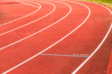 Red running track in stadium.