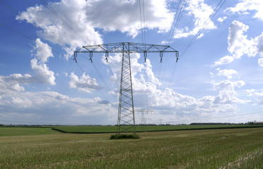 Power Lines: A 110 KV and a 220 KV high-voltage power line crossing over a stubblefield in Eastern...