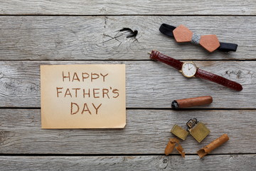 Happy Fathers Day card on rustic wood background