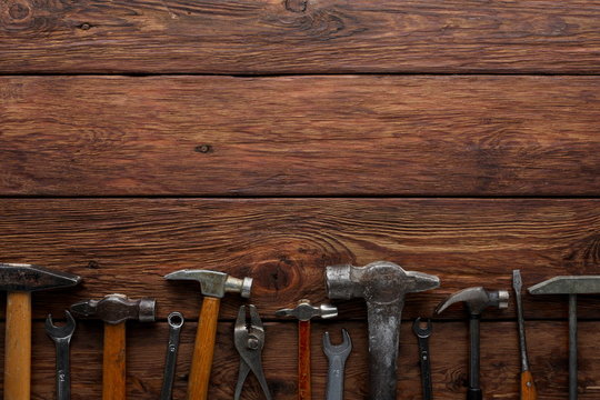 Border of repair tools on wood background with copy space