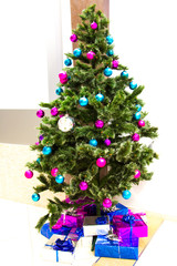 Christmas scene with tree gifts in the office.