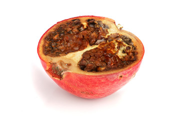 spoiled pomegranate isolated on white background closeup