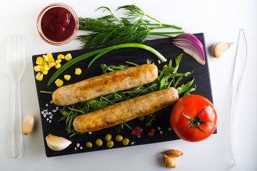 dish with sausages and vegetables, top view