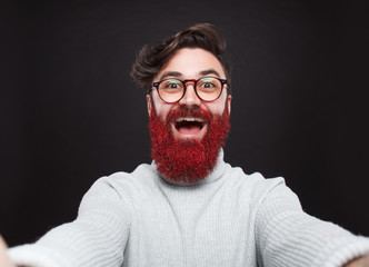 Bright hipster with glistening red beard