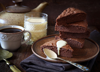 Chocolate cake. Genoise with English cream and cup of coffee