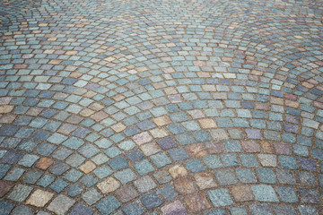 Old mosaic granite cobblestone pavement background. Abstract.