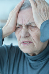 Obraz premium sad senior woman