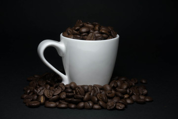 coffee beans and cups with low light