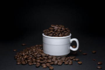 coffee beans and cups with low light