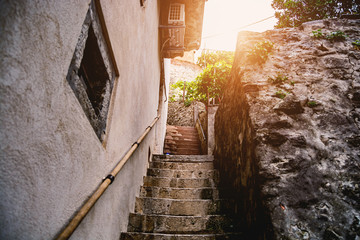 Stone steps between narrow streets of houses in Kotor