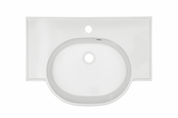 White oval washbasin in the bathroom of an artificial stone