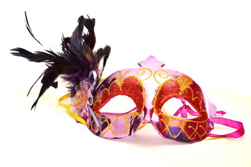 Purple gold carnival mask with bird feather. Isolated. White bacground