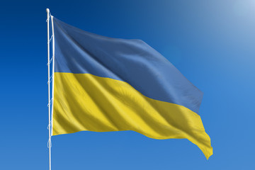 Ukraine flag in front of a clear blue sky