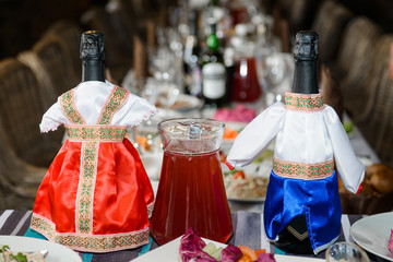 Slavic Costumes on wedding bottles.  National restaurant interiors for weddings. 