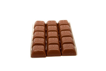 Tasty chocolate in squares on the white