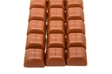 Tasty chocolate in squares on the white