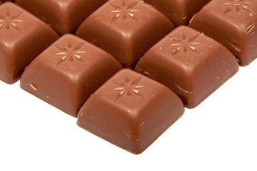 Tasty chocolate in squares on the white