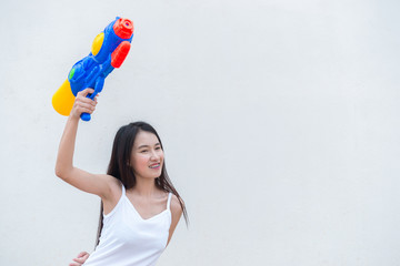 Asian sexy woman with water in hand on white background,Festival songkran day at thailand,The best of festival of thai,Land of smile