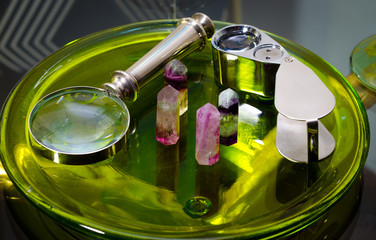 aquamarine crystal minirals gems with magnify glass