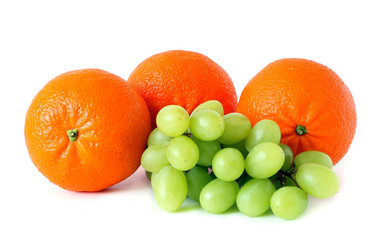 Ripe fresh orange mandarins & grapes. Detox diet food & healthy lifestyle concept: An aromatic colorful tasty delicious sweet fruits. Vegetarian concept, organic vitamins.