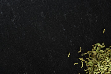 Spices fennel on the stone surface are large and place for advertising
