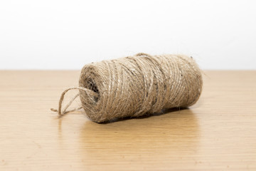 Roll of thin brown string
