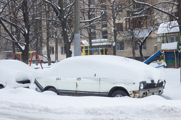 Parked car under snow