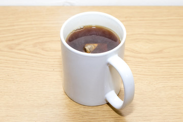 Cup of black tea with tea bag