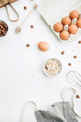 Raw food ingredients on white background. Flat lay, top view. Healthy nutrition concept.