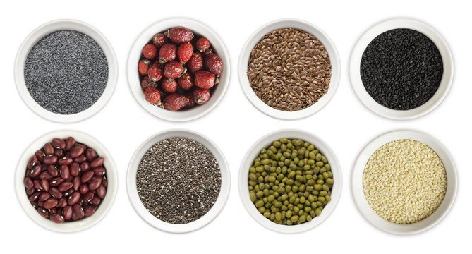 Set of superfood isolated on white background. Superfood with copy space for text. Seeds of flax, poppies, beans, mung beans, chia, sesame and rosehip. Top view. 