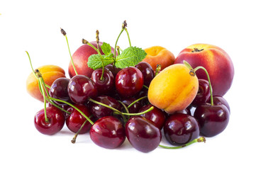 Ripe cherries, apricots and nectarines. Sweet fruits with copy space for text. Various fresh summer. Top view.