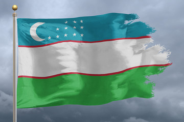 Uzbekistan Flag with torn edges in front of a stormy sky