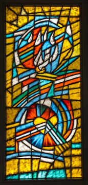 Olsztyn near Czestochowa, Poland, 25 February 2018: Colorful stained glass window with the Holy Spirit and the heart in the window of the chapel in the St. Anthony's Manor House in Olsztyn