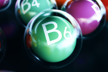 Vitamin B6 on black background. Symbol of health and longevity, 3d rendering